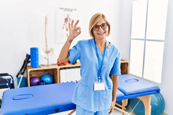 Middle Age Blonde Woman Working Pain Recovery Clinic Smiling Positive — Foto Stock