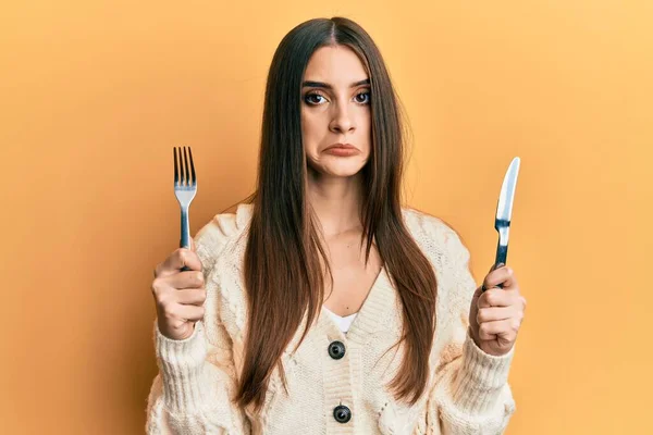 Beautiful Brunette Young Woman Holding Fork Knife Ready Eat Depressed — Stock Photo, Image