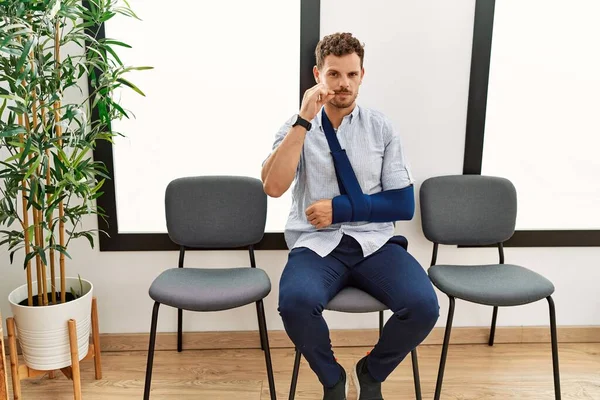 Handsome Young Man Sitting Doctor Waiting Room Arm Injury Mouth — Stockfoto