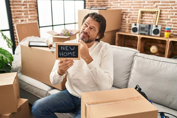 Handsome Middle Age Man Holding Blackboard New Home Text Serious — Fotografia de Stock