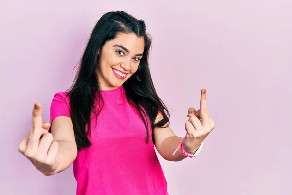 Young Hispanic Girl Wearing Casual Pink Shirt Showing Middle Finger — Φωτογραφία Αρχείου