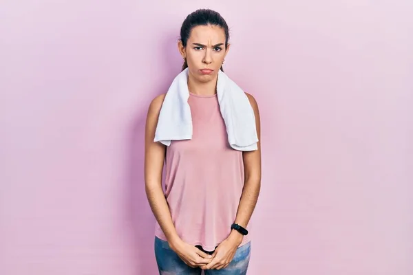 Young Brunette Woman Wearing Sportswear Towel Skeptic Nervous Frowning Upset — Stok fotoğraf