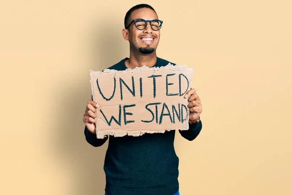 Young African American Man Holding United Stand Banner Celebrating Crazy — Stock Fotó