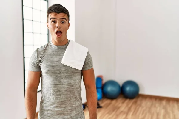 Young Hispanic Man Wearing Sportswear Towel Gym Afraid Shocked Surprise — Photo