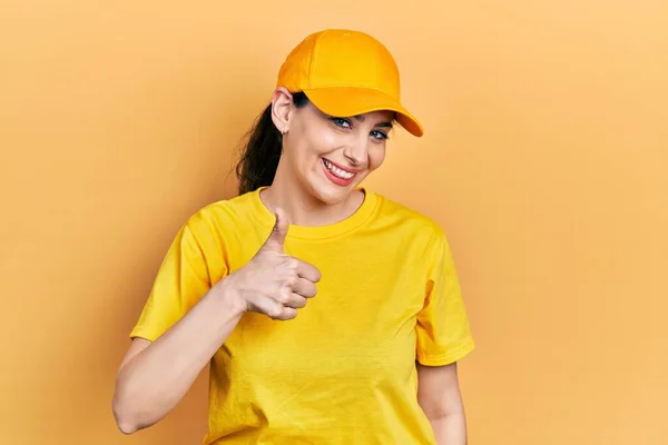 Young Hispanic Woman Wearing Delivery Uniform Cap Doing Happy Thumbs — Φωτογραφία Αρχείου