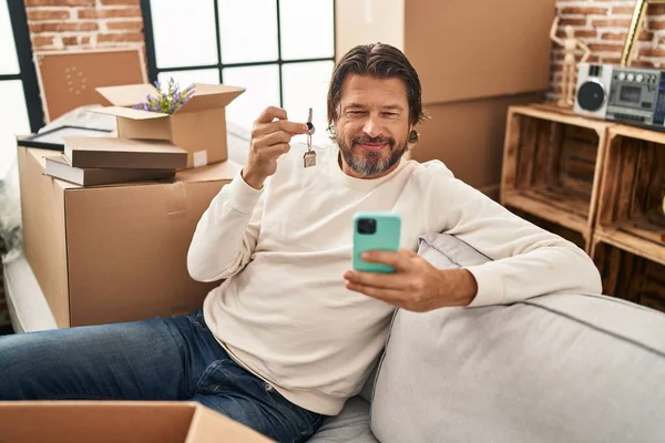 Handsome Middle Age Man Holding Keys New Home Doing Video — Stockfoto