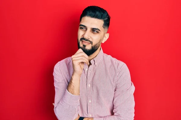 Handsome Man Beard Wearing Casual Red Shirt Serious Face Thinking — Stockfoto