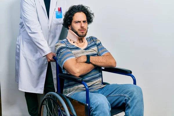 Handsome Hispanic Man Sitting Wheelchair Wearing Neck Collar Skeptic Nervous — стоковое фото