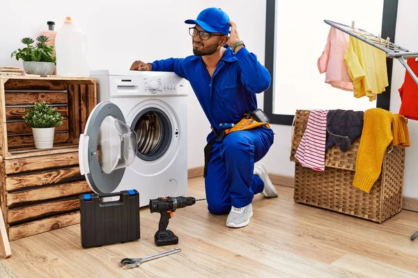 Young Indian Technician Working Washing Machine Confuse Wondering Question Uncertain — Foto de Stock
