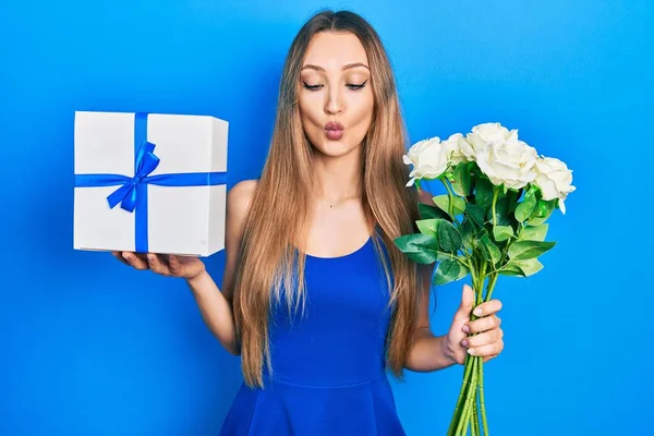 Young Blonde Girl Holding Anniversary Present Bouquet Flowers Making Fish — Foto de Stock