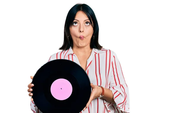 Young Hispanic Girl Holding Vinyl Disc Making Fish Face Mouth — Stock Photo, Image