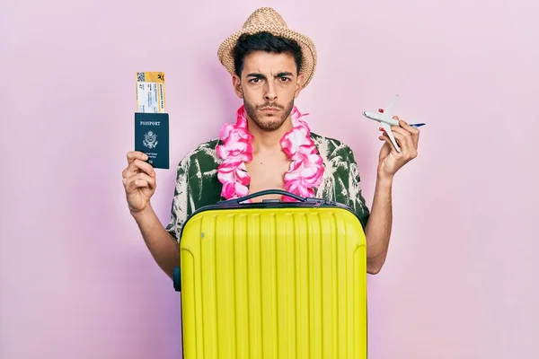 Young Hispanic Man Wearing Summer Style Hawaiian Lei Holding Passport — Stock Photo, Image