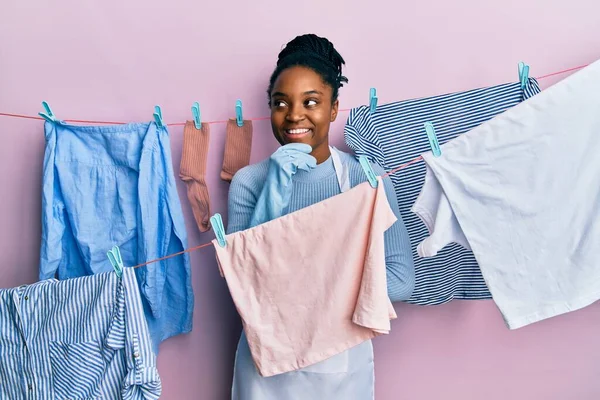 African American Woman Braided Hair Washing Clothes Clothesline Hand Chin — Stock Photo, Image