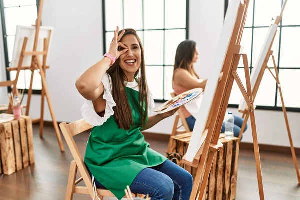 Young Hispanic Artist Women Painting Canvas Art Studio Doing Happy — Stock Photo, Image