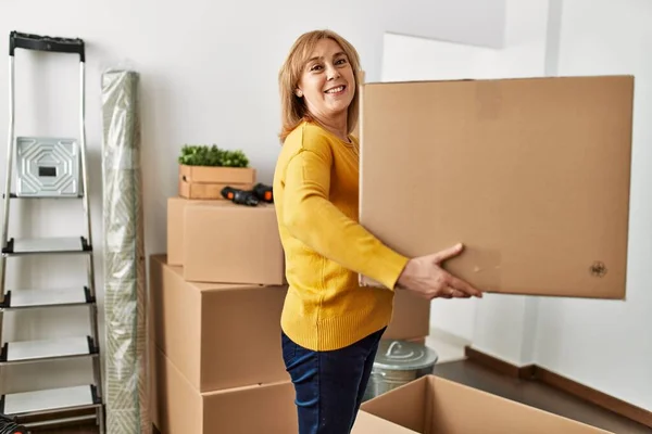 Middle Age Blonde Woman Smiling Happy Holding Cardboard Box New — Stock Photo, Image