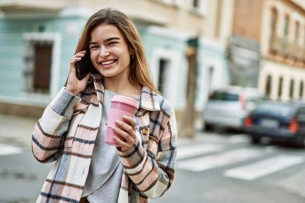 Young Blonde Woman Holding Coffee Talking Smartphone Street — Fotografia de Stock