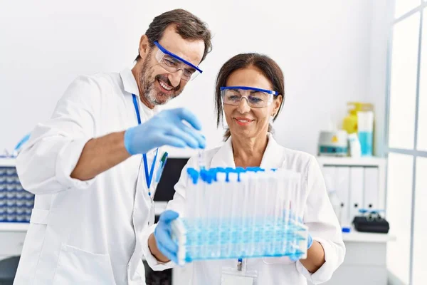 Middle Age Man Woman Partners Wearing Scientist Uniform Holding Test — Stock Photo, Image
