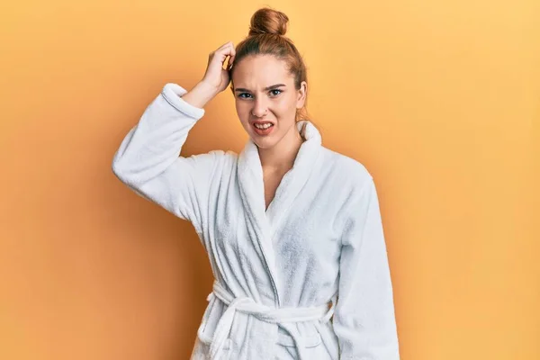 Young Blonde Woman Wearing Bathrobe Confuse Wonder Question Uncertain Doubt — Stock Photo, Image