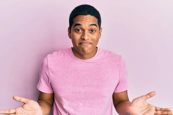 Young Handsome Hispanic Man Wearing Casual Pink Shirt Clueless Confused — Stock Photo, Image