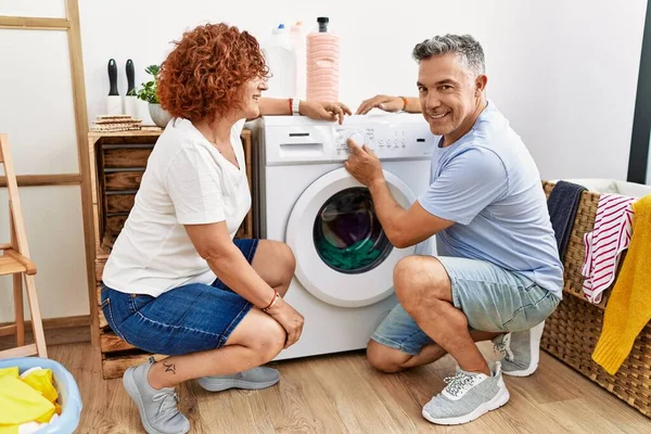 Middle Age Man Woman Couple Smiling Confident Turning Washing Clothes — Stock Photo, Image