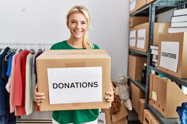 Young Blonde Volunteer Girl Smiling Happy Holding Donations Box Charity — Stock Photo, Image