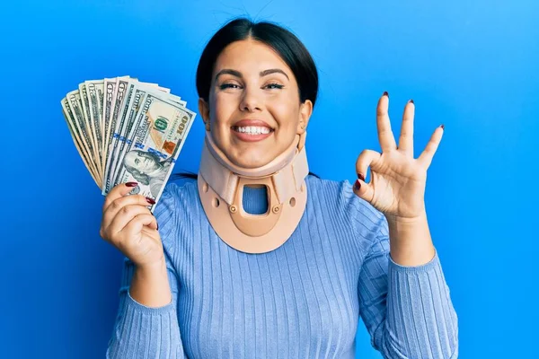 Beautiful Brunette Woman Wearing Cervical Collar Holding Insurance Money Doing — Stock Photo, Image