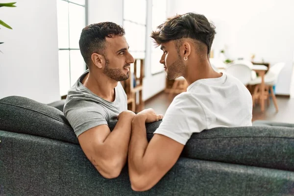 Two Hispanic Men Couple Smiling Confident Sitting Sofa Home — Φωτογραφία Αρχείου
