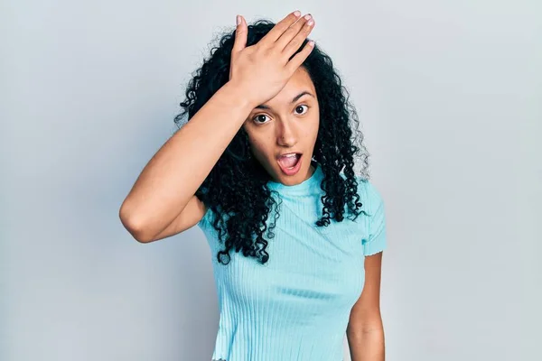 Young Hispanic Woman Curly Hair Wearing Casual Blue Shirt Surprised — Stock Photo, Image