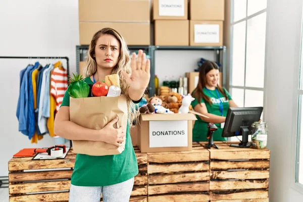 Young Blonde Woman Volunteer Center Holding Donations Paper Box Open — Stock Photo, Image