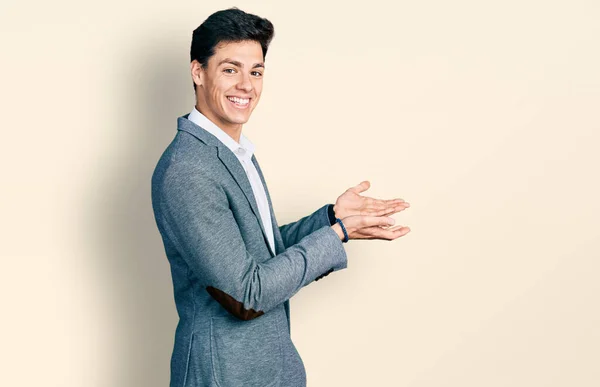 Young Hispanic Man Wearing Business Clothes Pointing Aside Hands Open — Stock Photo, Image