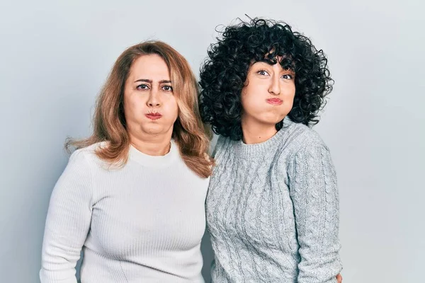 Middle East Mother Daughter Wearing Casual Clothes Puffing Cheeks Funny — Stock Photo, Image