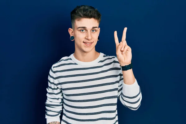 Young Caucasian Boy Ears Dilation Wearing Casual Striped Shirt Showing — Stock Photo, Image