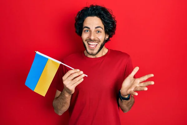 Handsome Hispanic Man Wearing Ukraine Flag Celebrating Achievement Happy Smile — Stock Photo, Image