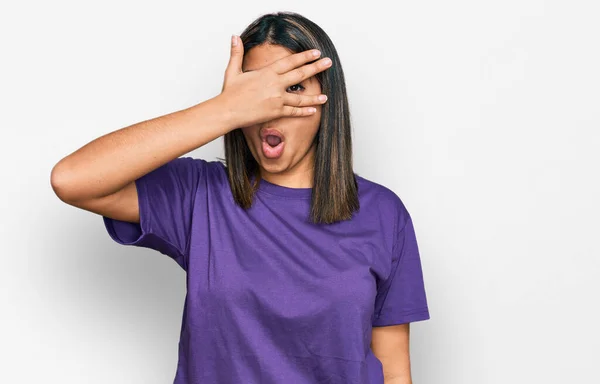 Young Hispanic Girl Wearing Casual Purple Shirt Peeking Shock Covering — Stock Photo, Image