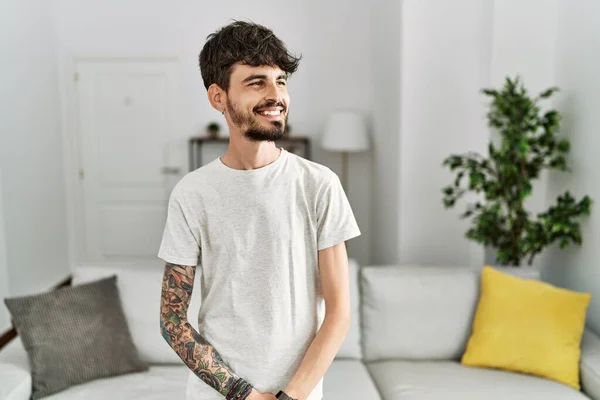 Hispanic Man Beard Living Room Home Looking Away Side Smile — Stock Photo, Image