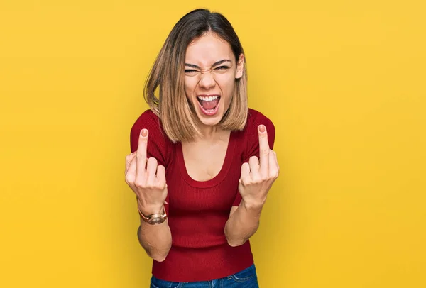 Young Blonde Girl Wearing Casual Clothes Showing Middle Finger Doing — Stok Foto