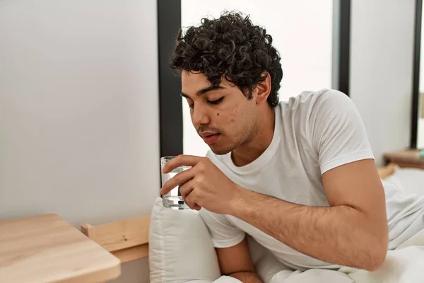 Young Hispanic Man Drinking Water Sitting Bed Bedroom — Stock Photo, Image