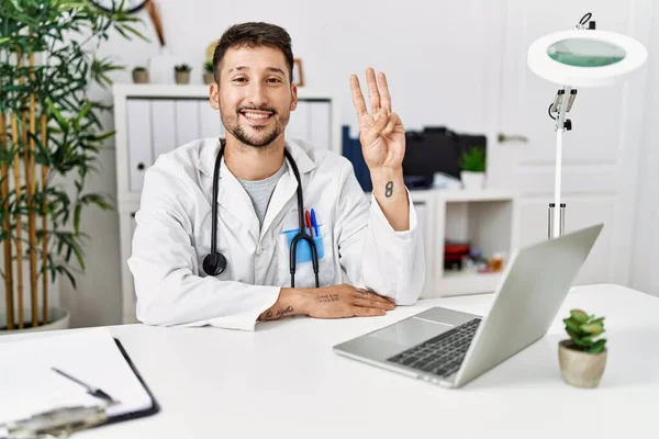 Young Doctor Working Clinic Using Computer Laptop Showing Pointing Fingers — Stock Photo, Image