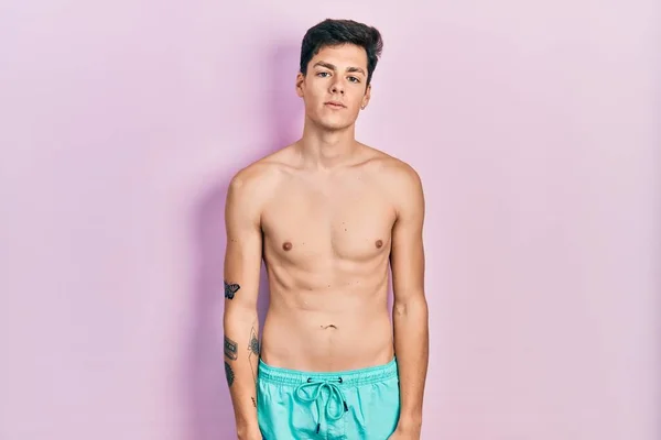 Young Hispanic Man Wearing Swimwear Shirtless Relaxed Serious Expression Face — Stock Photo, Image