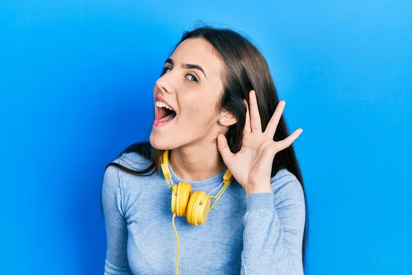 Young Brunette Teenager Wearing Headphones Neck Smiling Hand Ear Listening — Stock Photo, Image