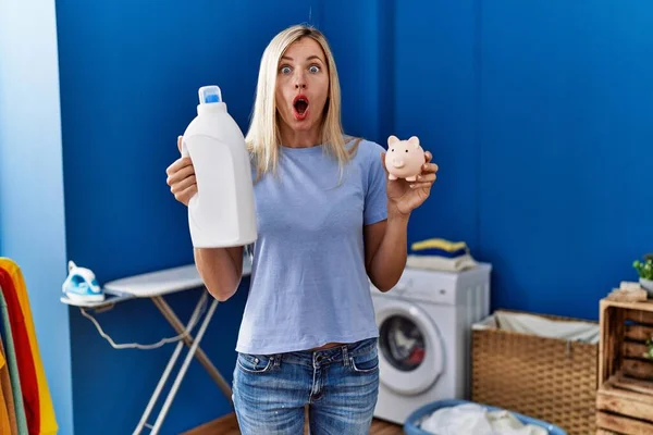 Beautiful Woman Doing Laundry Holding Detergent Bottle Piggy Bank Afraid — Stock Photo, Image