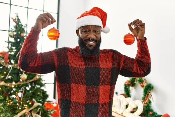 Young African American Man Smiling Confident Holding Balls Standing Christmas — Stock Photo, Image