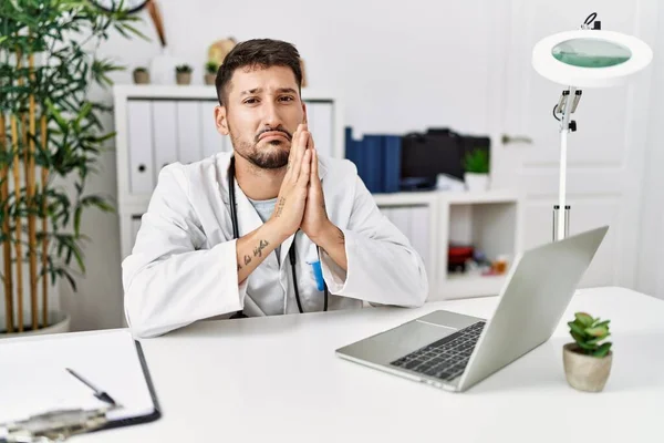 Young Doctor Working Clinic Using Computer Laptop Begging Praying Hands — Stock Photo, Image