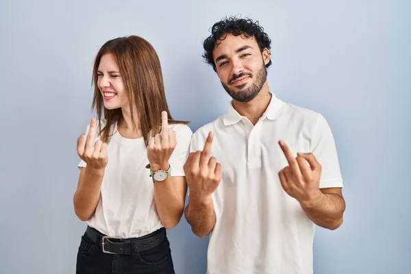 Young Couple Wearing Casual Clothes Standing Together Showing Middle Finger — 图库照片