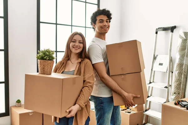 Young Couple Smiling Happy Holding Cardboard Boxes New Home — Stock Photo, Image