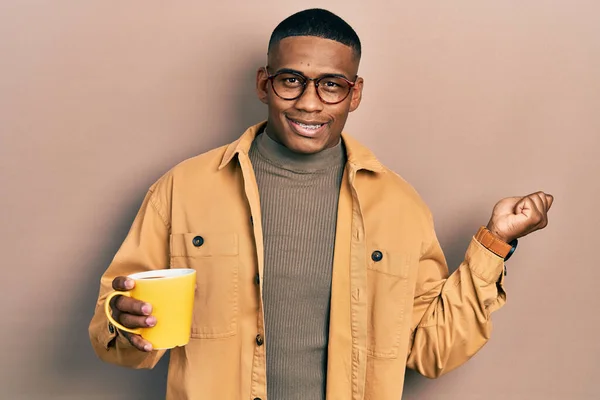Young Black Man Wearing Glasses Drinking Cup Coffee Screaming Proud — Fotografia de Stock