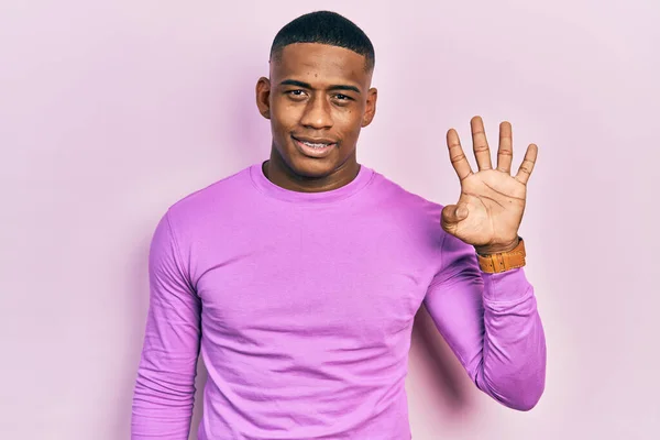 Young Black Man Wearing Casual Pink Sweater Showing Pointing Fingers — Photo