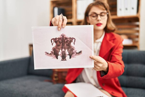 Young caucasian woman psychologist having rorscharch test at psychology center