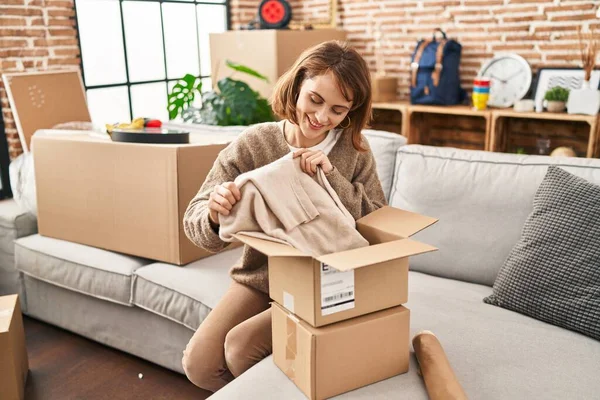 Young Caucasian Woman Smiling Confident Unboxing Package New Home — ストック写真
