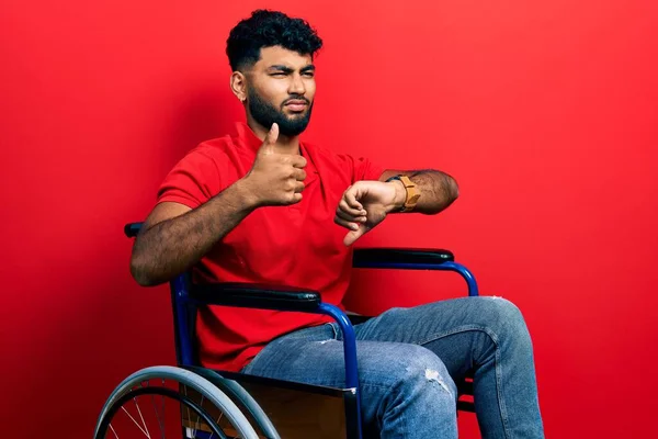 Arab Man Beard Sitting Wheelchair Doing Thumbs Disagreement Agreement Expression — Stock Photo, Image
